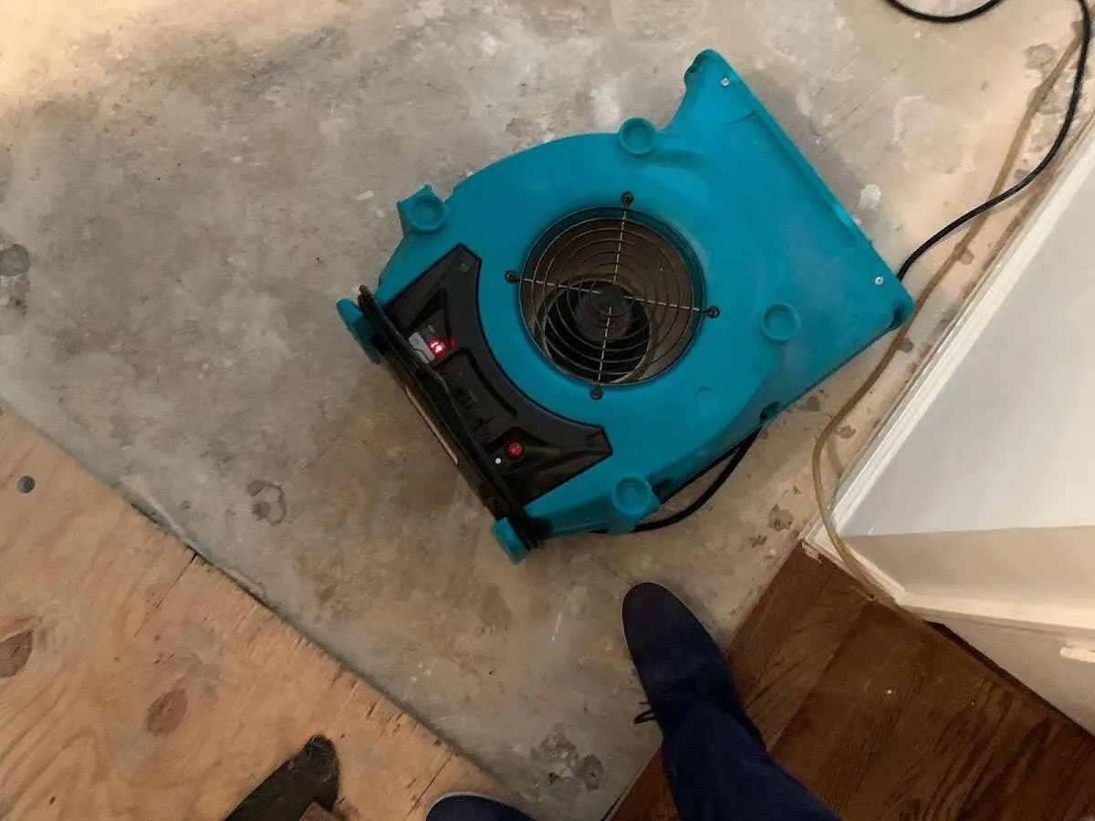 Air mover drying subfloor during Leak Detection & Repair in Rexburg